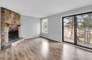 1418 Ranchlands Road Nw, Calgary, AB  - Indoor Photo Showing Living Room With Fireplace 