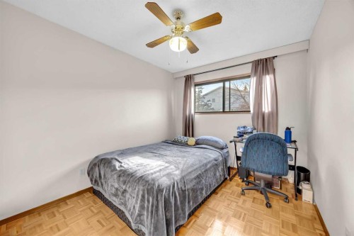 49 Beacham Way Nw, Calgary, AB - Indoor Photo Showing Bedroom