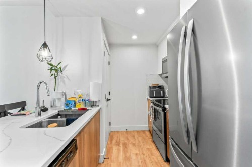 110 Savanna Walk Ne, Calgary, AB - Indoor Photo Showing Kitchen With Stainless Steel Kitchen With Double Sink With Upgraded Kitchen