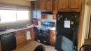 1908 Olympia Drive Se, Calgary, AB  - Indoor Photo Showing Kitchen With Double Sink 