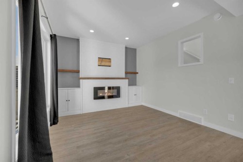 85 Reynolds Road, Sylvan Lake, AB - Indoor With Fireplace