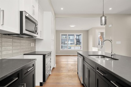122 Sora Gardens Se, Calgary, AB - Indoor Photo Showing Kitchen With Double Sink With Upgraded Kitchen