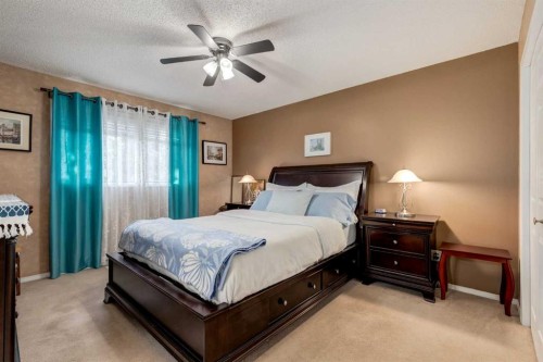 35 Woodstock Road Sw, Calgary, AB - Indoor Photo Showing Bedroom