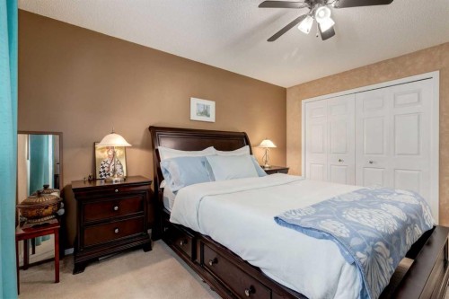 35 Woodstock Road Sw, Calgary, AB - Indoor Photo Showing Bedroom