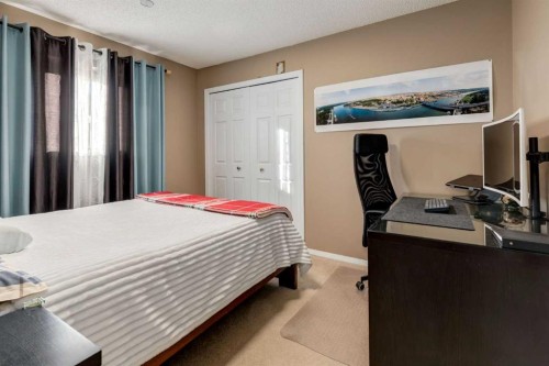 35 Woodstock Road Sw, Calgary, AB - Indoor Photo Showing Bedroom