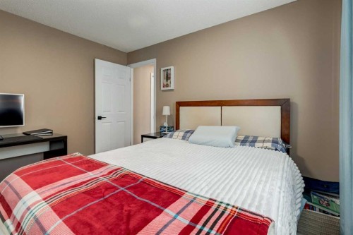 35 Woodstock Road Sw, Calgary, AB - Indoor Photo Showing Bedroom
