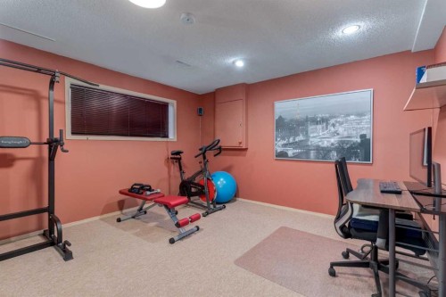 35 Woodstock Road Sw, Calgary, AB - Indoor Photo Showing Gym Room