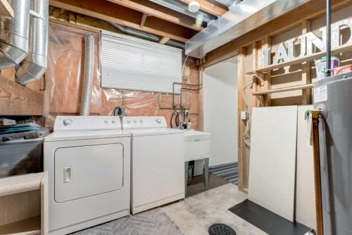 35 Woodstock Road Sw, Calgary, AB - Indoor Photo Showing Laundry Room