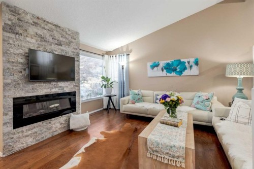 35 Woodstock Road Sw, Calgary, AB - Indoor Photo Showing Living Room With Fireplace
