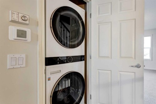 236 Somme Avenue Sw, Calgary, AB - Indoor Photo Showing Laundry Room
