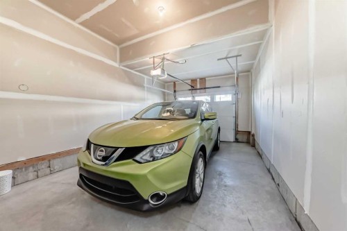 615 Kingsmere Way Se, Airdrie, AB - Indoor Photo Showing Garage