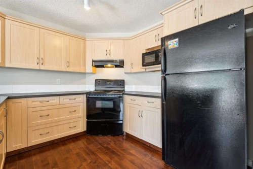 73 Rocky Ridge Heath Nw, Calgary, AB - Indoor Photo Showing Kitchen