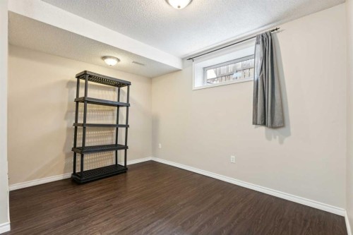 73 Rocky Ridge Heath Nw, Calgary, AB - Indoor Photo Showing Other Room