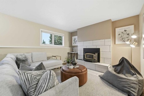 471 Dalmeny Hill Nw, Calgary, AB - Indoor Photo Showing Living Room With Fireplace