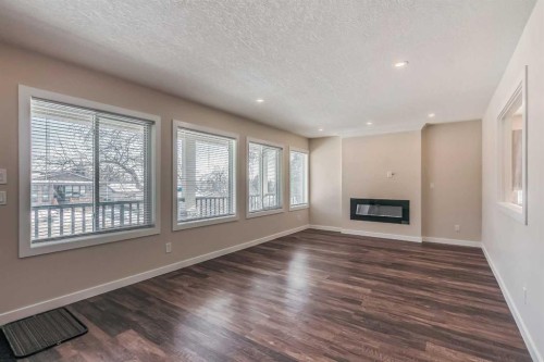 23 Cheltenham Road Nw, Calgary, AB - Indoor With Fireplace