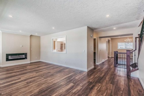 23 Cheltenham Road Nw, Calgary, AB - Indoor With Fireplace