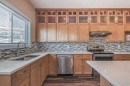 23 Cheltenham Road Nw, Calgary, AB  - Indoor Photo Showing Kitchen With Double Sink With Upgraded Kitchen 