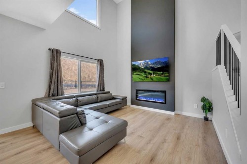 3021 Key Drive Sw, Airdrie, AB - Indoor Photo Showing Living Room With Fireplace