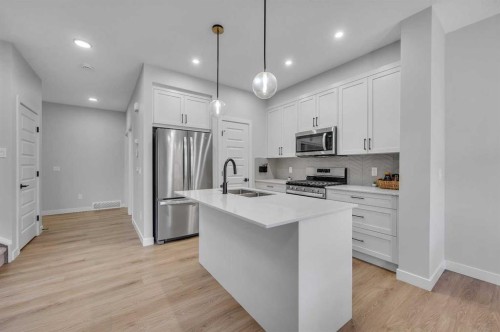 3021 Key Drive Sw, Airdrie, AB - Indoor Photo Showing Kitchen With Double Sink With Upgraded Kitchen
