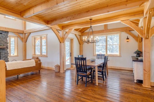 231035 Range Road 54, Bragg Creek, AB - Indoor Photo Showing Dining Room With Fireplace