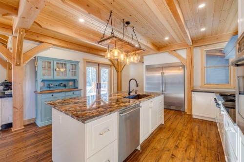 231035 Range Road 54, Bragg Creek, AB - Indoor Photo Showing Kitchen With Upgraded Kitchen