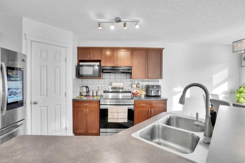 73 Covebrook Place Ne, Calgary, AB - Indoor Photo Showing Kitchen With Double Sink