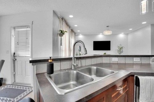 73 Covebrook Place Ne, Calgary, AB - Indoor Photo Showing Kitchen With Double Sink