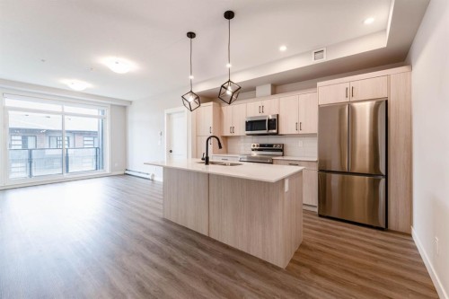2312-55 Lucas Way Nw, Calgary, AB - Indoor Photo Showing Kitchen With Stainless Steel Kitchen With Upgraded Kitchen