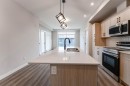 2312-55 Lucas Way Nw, Calgary, AB  - Indoor Photo Showing Kitchen With Double Sink 