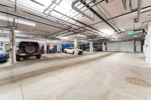 2312-55 Lucas Way Nw, Calgary, AB - Indoor Photo Showing Garage