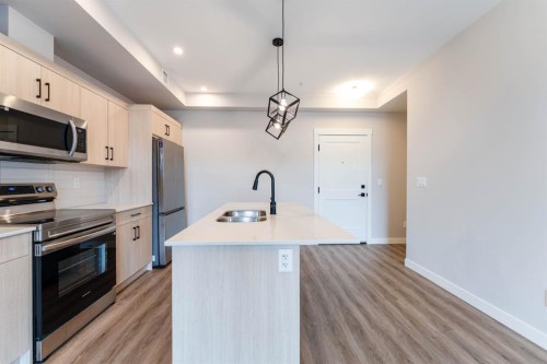 2312-55 Lucas Way Nw, Calgary, AB - Indoor Photo Showing Kitchen With Stainless Steel Kitchen With Double Sink With Upgraded Kitchen