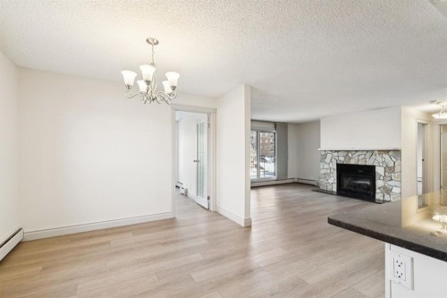 6-1607 26 Avenue Sw, Calgary, AB - Indoor Photo Showing Living Room With Fireplace
