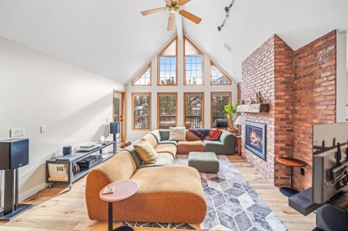 108 Lougheed Circle, Banff, AB - Indoor Photo Showing Living Room With Fireplace