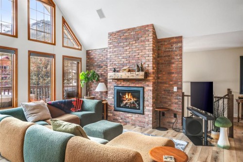108 Lougheed Circle, Banff, AB - Indoor Photo Showing Living Room With Fireplace
