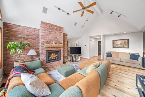 108 Lougheed Circle, Banff, AB - Indoor Photo Showing Living Room With Fireplace