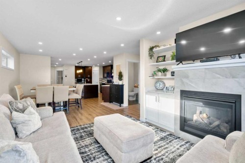 17 Cranford Place Se, Calgary, AB - Indoor Photo Showing Living Room With Fireplace