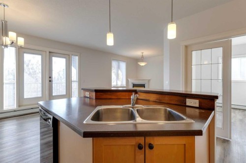 304-1606 4 Street Nw, Calgary, AB - Indoor Photo Showing Kitchen With Double Sink