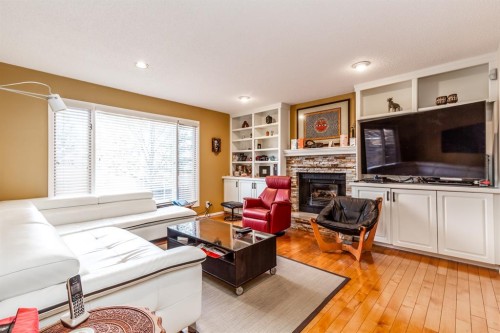63 Edgeridge Court Nw, Calgary, AB - Indoor Photo Showing Living Room With Fireplace