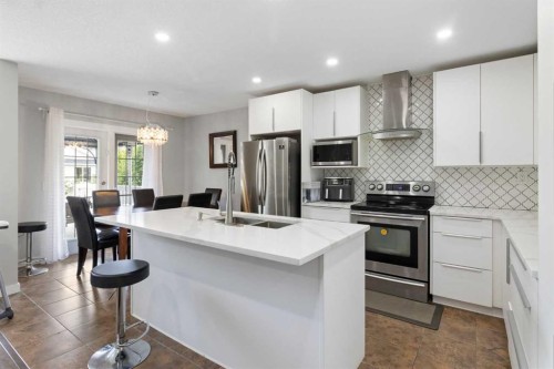 31 Bridlewood Road Sw, Calgary, AB - Indoor Photo Showing Kitchen With Stainless Steel Kitchen With Double Sink With Upgraded Kitchen