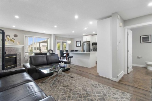 31 Bridlewood Road Sw, Calgary, AB - Indoor Photo Showing Living Room With Fireplace
