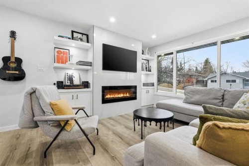 711 101 Avenue Sw, Calgary, AB - Indoor Photo Showing Living Room With Fireplace