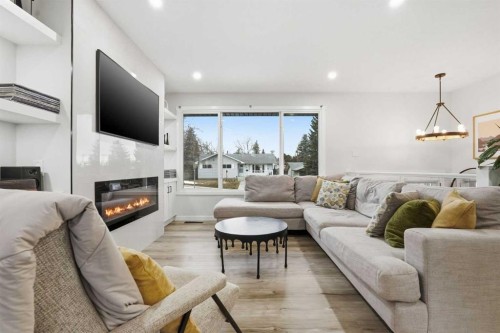 711 101 Avenue Sw, Calgary, AB - Indoor Photo Showing Living Room With Fireplace