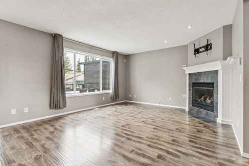 132 Citadel Meadow Bay Nw, Calgary, AB - Indoor Photo Showing Other Room With Fireplace