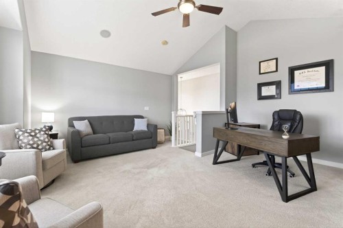 4 Cougarstone Square Sw, Calgary, AB - Indoor Photo Showing Living Room
