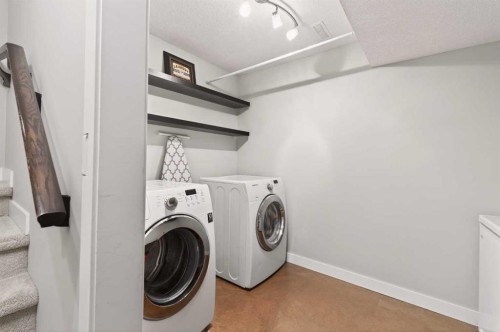 4 Cougarstone Square Sw, Calgary, AB - Indoor Photo Showing Laundry Room