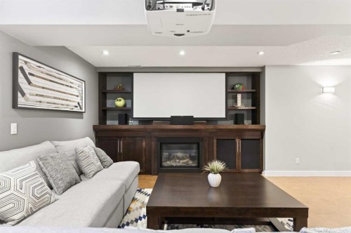 4 Cougarstone Square Sw, Calgary, AB - Indoor With Fireplace