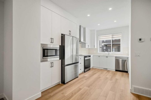 202-550 Seton Circle Se, Calgary, AB - Indoor Photo Showing Kitchen