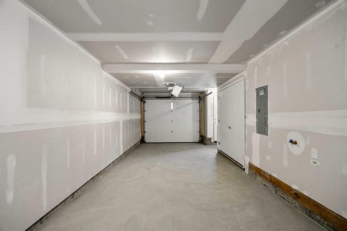 202-550 Seton Circle Se, Calgary, AB - Indoor Photo Showing Garage