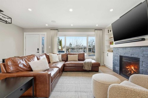8615 7 Street Sw, Calgary, AB - Indoor Photo Showing Living Room With Fireplace
