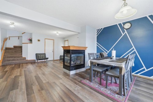 218 Tarawood Place Ne, Calgary, AB - Indoor With Fireplace